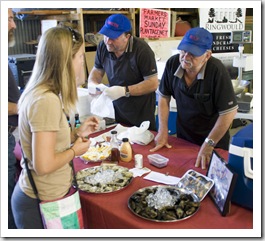 Lisa talking to one of the oyster merchants at the Boat Shed Markets