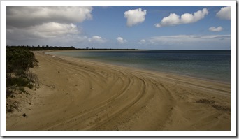 Boggy sand along Seven Mile Beach