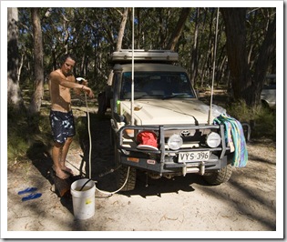 Chris enjoying a hot shower at Strachans campground