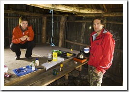 Lisa and Chris sheltering themselves for lunch in the Howitt Plains Hut