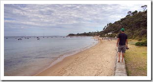 Sam walking along the beach in Portsea