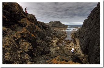 Lisa, Greg and Grant clambering on the rocks on the way into the cave at Seal Rocks