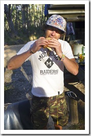 Chris enjoying the best bacon and egg sandwich ever at Strachans campground