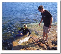 Greg helping Sam with a Yelloweye Mullet in Coles Bay