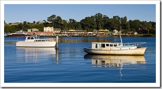 Fishing boats in the morning light in Strahan