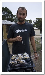 Sam cooking fresh oysters in Saint Helens