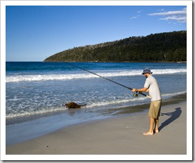 Sam fishing for Salmon Trout at Fortescue Bay