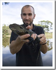 Sam and an Eastern Water Dragon on the banks of the Snowy River