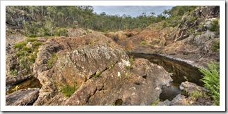 The red rocks at the top of Raymond Falls