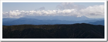 The Razorback Trail with Mount Bogong in the clouds in the distance
