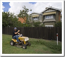 Sam helping with the yard work at the Detmold house in Echuca