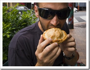 Sam sampling the fare from Pot Belly Pies in Maclean