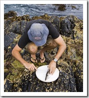 Sam cleaning a Sand Whiting at Aragunnu