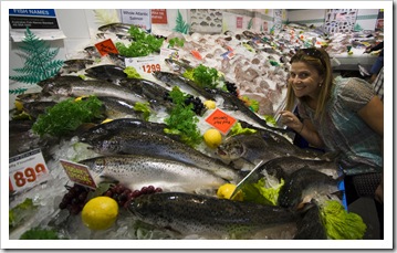Lisa amongst a sea of fish at the Sydney Fish Market