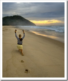 Lisa doing her morning exercises on the beach at sunrise in Hat Head National Park