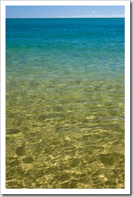 Crystal clear water on the beach at Sandy Cape