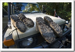 Drying the mud on our shoes after our Mount Sorrow climb