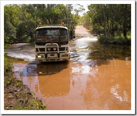 Trucks tackling the water crossings on Battle Camp Road