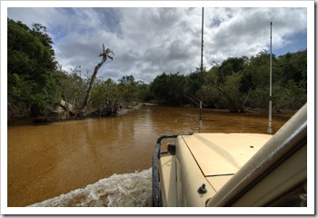 Tackling some deeper water across the Pascoe River on the way into Iron Range National Park