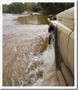 Tackling some deeper water across the Pascoe River on the way into Iron Range National Park