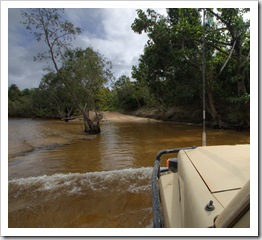 Tackling some deeper water across the Pascoe River on the way into Iron Range National Park