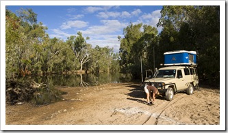 Lisa stretching after a lot of driving at our brilliant campsite on the banks of Emu Creek