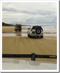 The Tank and Peter crossing one of the many freshwater streams running into the ocean along the eastern beach