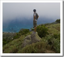 Sam in the clouds at the top of Cook's Look with Watson's Bay in the distance