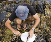 Sam cleaning a Sand Whiting at Aragunnu